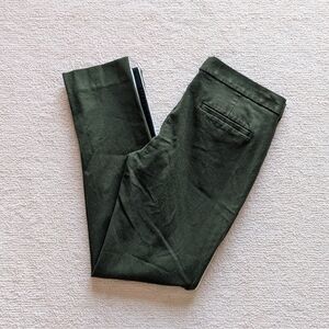 Banana Republic Sloan pants in green with black and white accents, size 10L